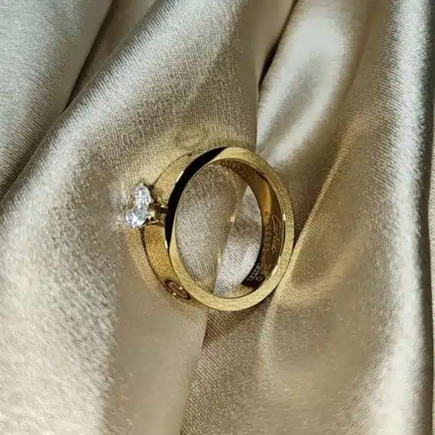 Experience luxury that lasts with our 18K Gold Plated Stainless Steel Ring, designed to bring shine and sophistication to your everyday style. Crafted with precision and care, this ring offers the beauty of real gold with the strength of stainless steel — making it both elegant and enduring. 💫 Key Features: 18K Gold Plated Finish: Rich, radiant, and long-lasting — crafted to mirror the glow of genuine gold. Premium Stainless Steel Base: Ensures durability, strength, and resistance to daily wear. Anti-Tarnish & Water Resistant: Made to retain its luster without fading or rusting over time. Skin-Friendly: Hypoallergenic and safe for all skin types. Versatile Design: Minimal yet classy — perfect for stacking, gifting, or wearing solo. This ring is your go-to accessory for any occasion — whether it’s an everyday statement or a touch of gold for special moments.