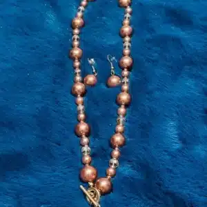 Brown pearl necklace with pearl earring different lock
